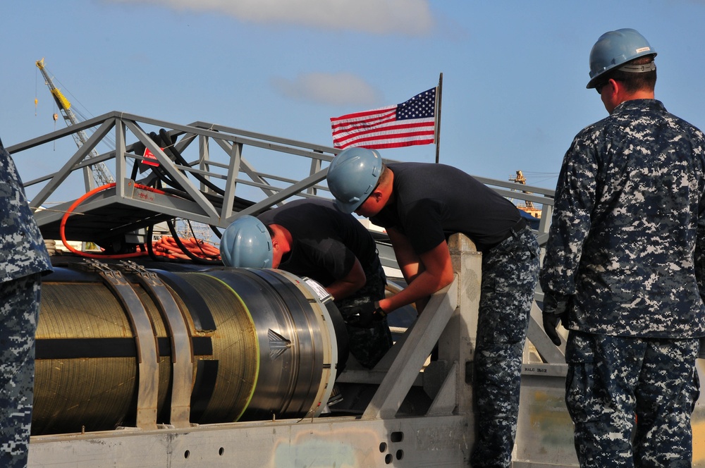 Loading a Tomahawk land attack missile onto USS Michigan