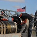 Loading a Tomahawk land attack missile onto USS Michigan