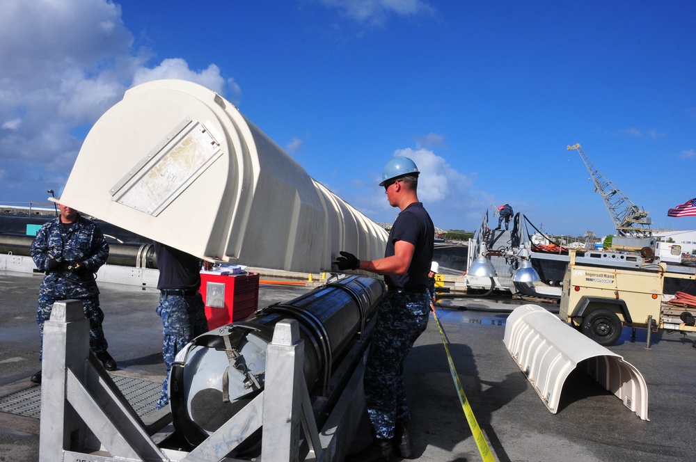 Loading a Tomahawk land attack missile onto USS Michigan