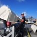 Loading a Tomahawk land attack missile onto USS Michigan