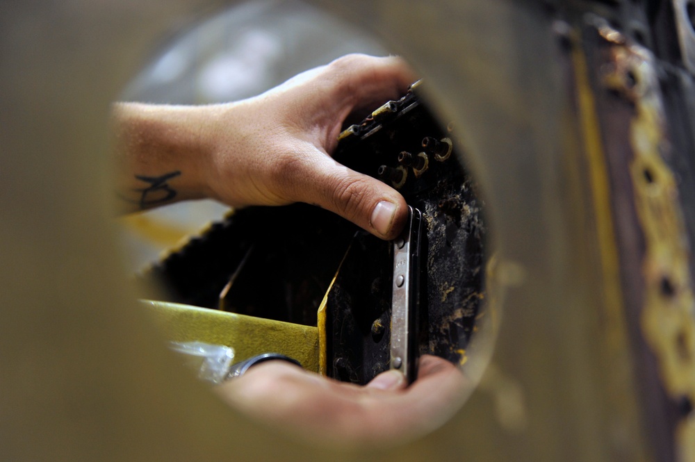 Airman rebuild a tornado damaged C-130