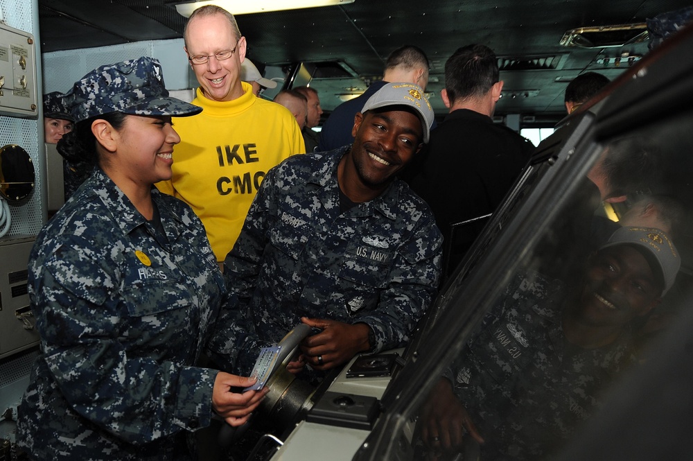 Sailor mans the USS Dwight D. Eisenhower helm