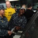 Sailor mans the USS Dwight D. Eisenhower helm