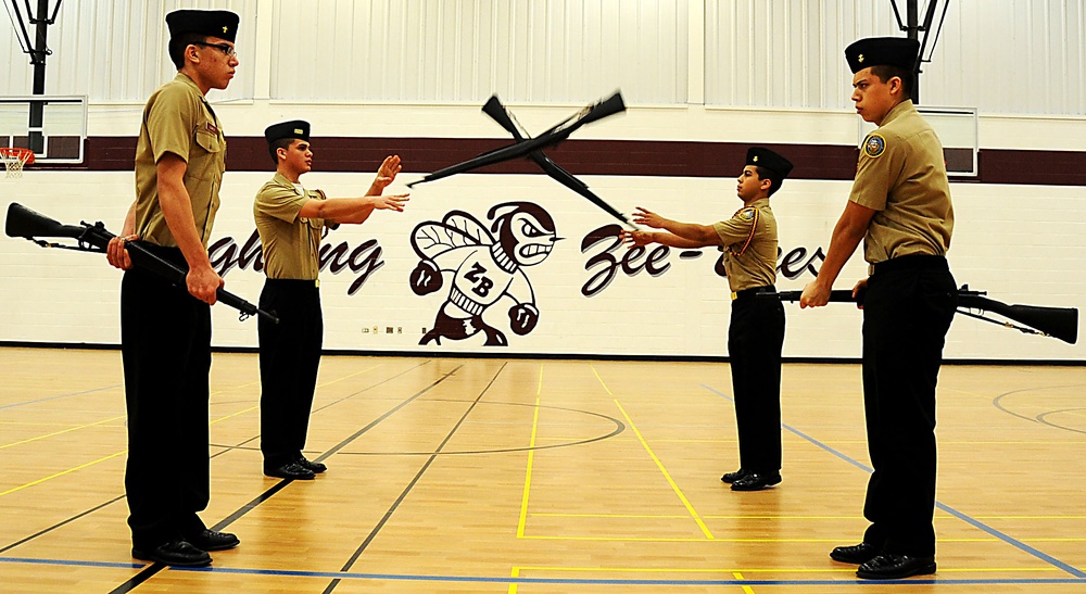 Navy JROTC unit performs unarmed and armed drill