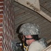 Wiring for the future: 1194th soldiers install electrical wiring in building at Camp Ravenna