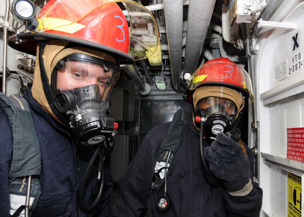 USS Simpson sailor during casualty drill