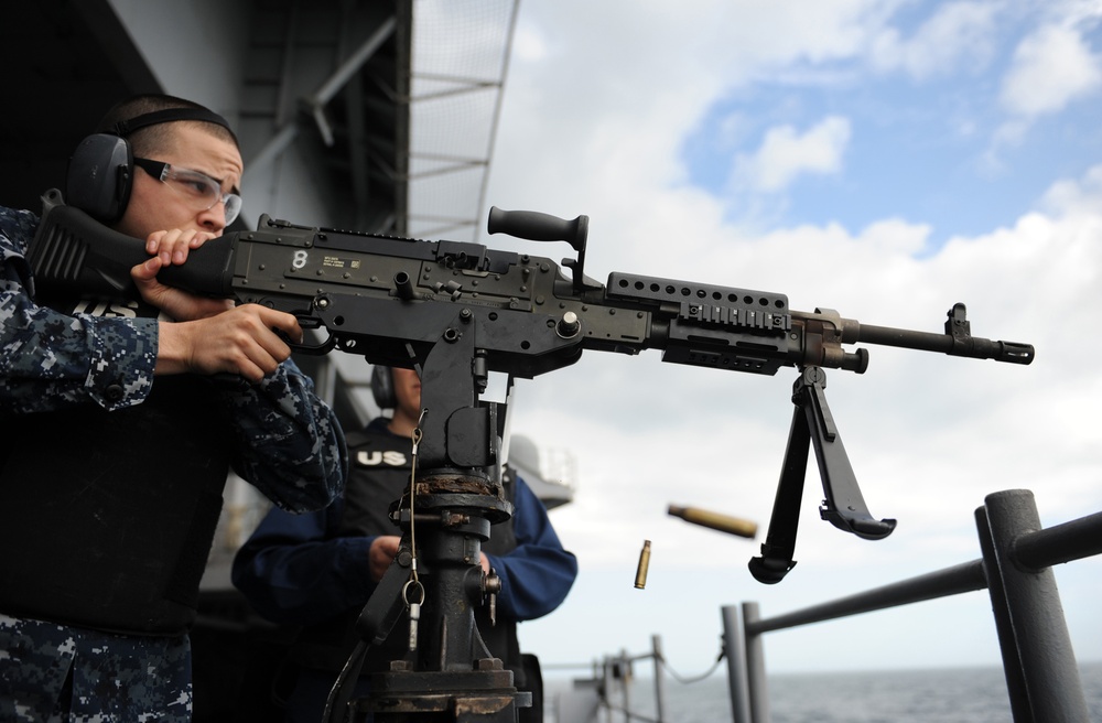 USS George H.W. Bush sailor fires machine gun