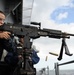 USS George H.W. Bush sailor fires machine gun