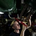 USS Carl Vinson sailor performs maintenance on valve