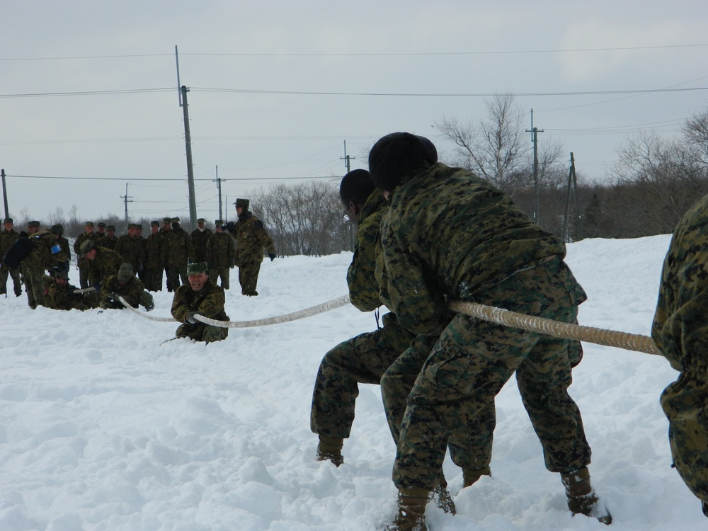 JGSDF, Marines compete in a tug-of-war competition during Forest Light