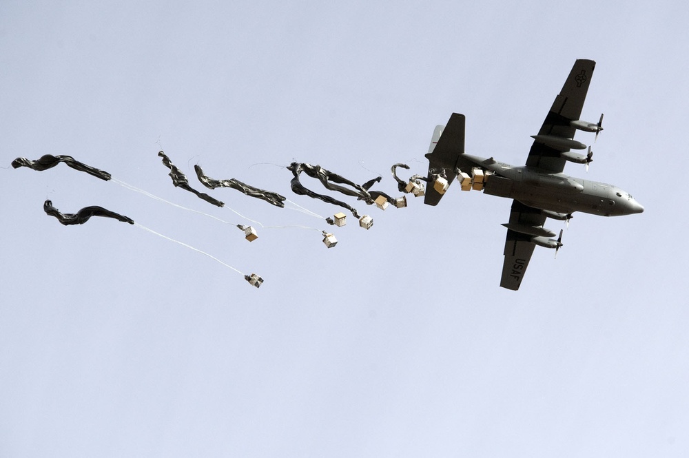 Coalition forces receive supplies via CDS drop