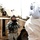Big Island Military Police Training March 23-24 The image shows U.S. Army soldiers in ACU (Army Combat Uniform) interacting with a civilian near a military HMMWV (Humvee) vehicle. One soldier stands in front of the vehicle holding a rifle while appearing to speak with a person wearing traditional Middle Eastern white robes and a keffiyeh. A second soldier is positioned in the vehicle's turret.