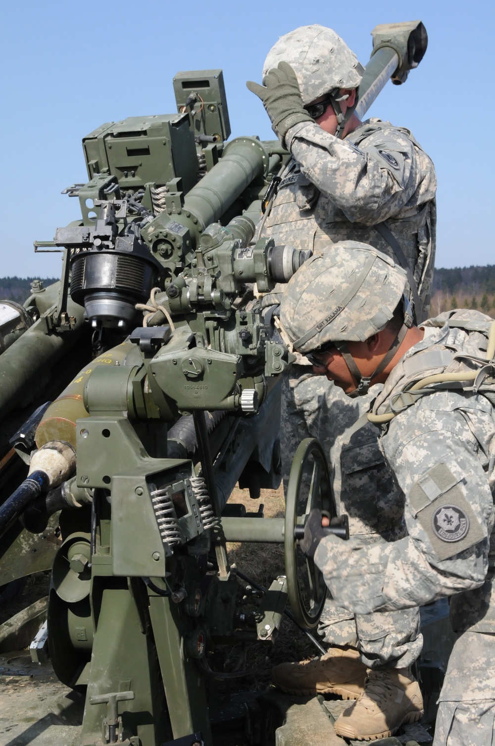 Soldiers preparing to fire M777 Howitzer