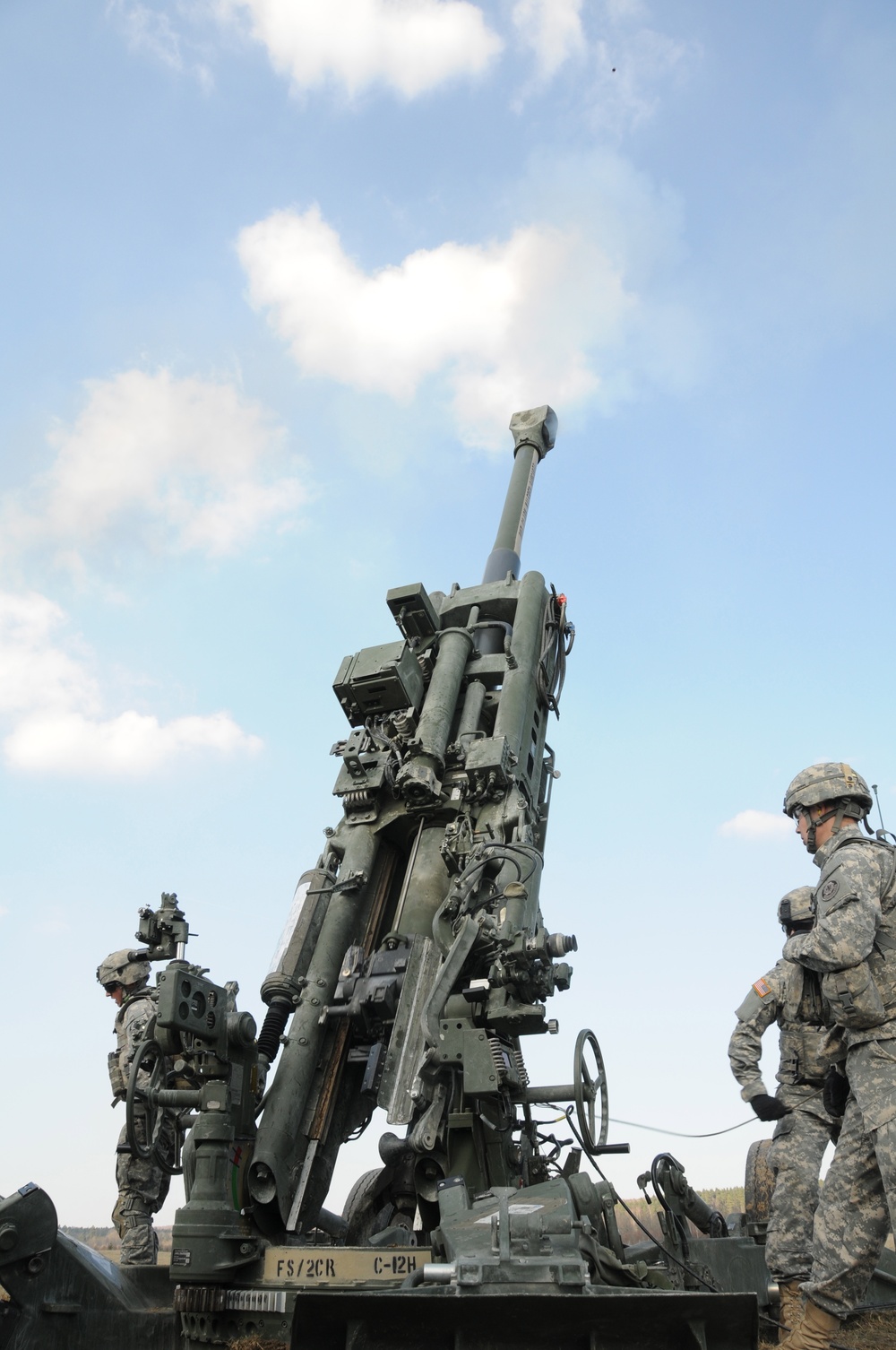 Soldiers from C Company, 1st Platoon, Fires Squadron, 2nd Cavalry Regiment, fire M777 Howitzer