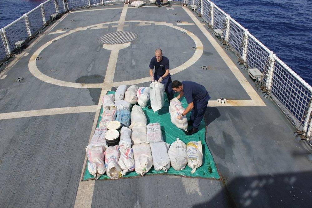 CGC Confidence crewmembers stack packages of seized marijuana