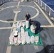 CGC Confidence crewmembers stack packages of seized marijuana