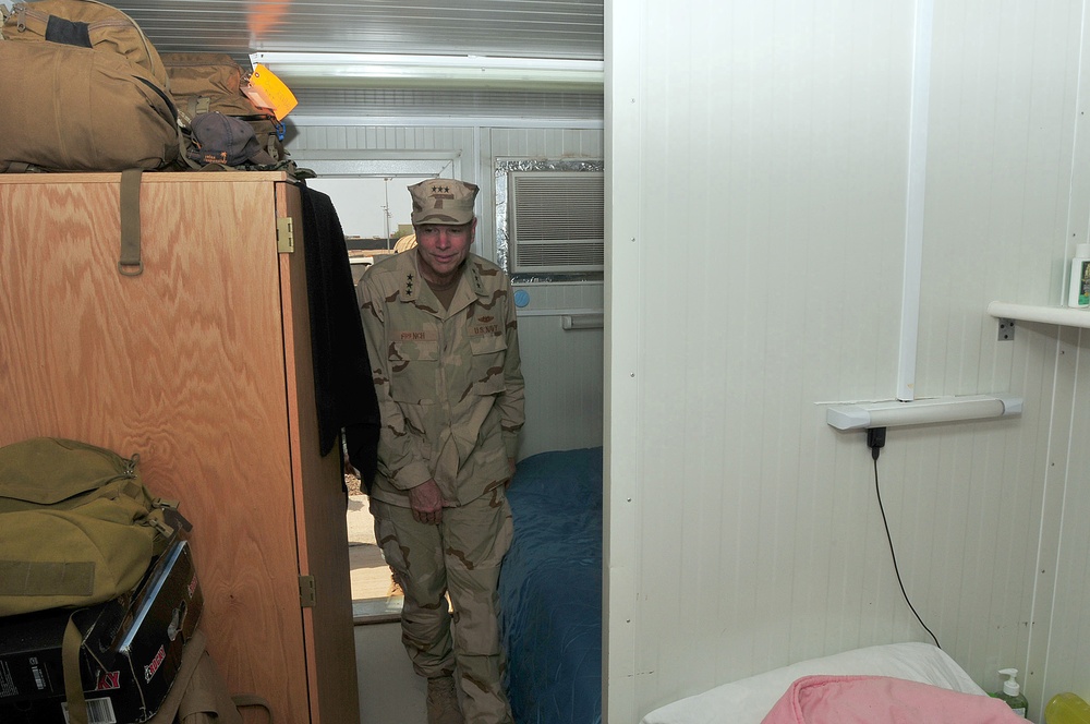 Vice Adm. William French tours a containerized living unit