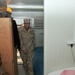 Vice Adm. William French tours a containerized living unit