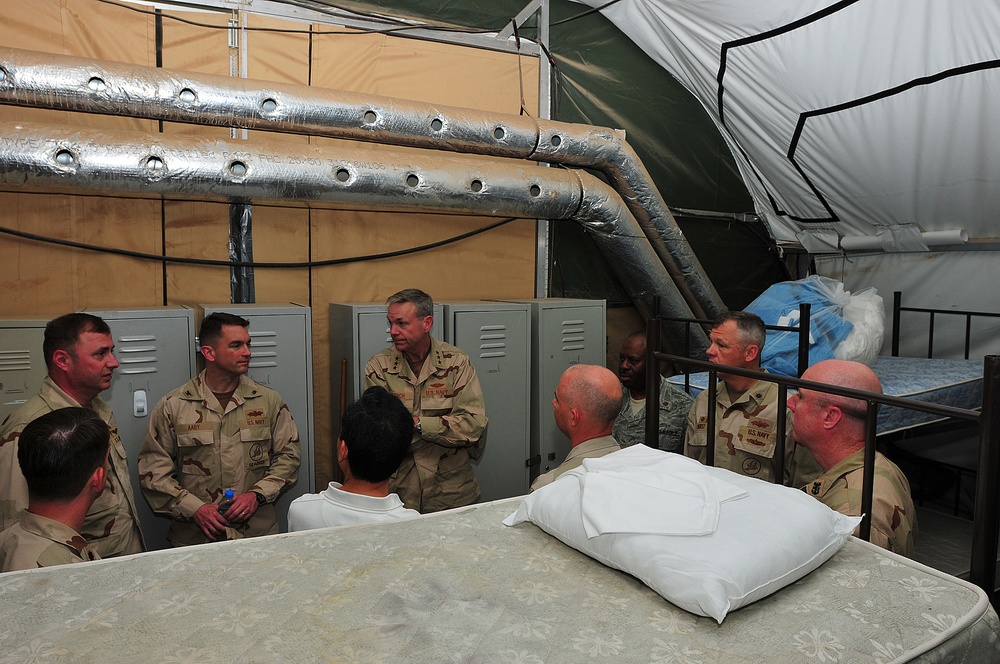 Vice Adm. William French tours a containerized living unit