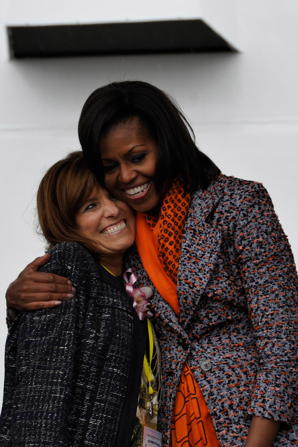 First Lady Michelle Obama congratulates Melinda Cook, the grandniece of US Coast Guard Capt. Dorothy Stratton during the commissioning ceremony of the Cutter Stratton