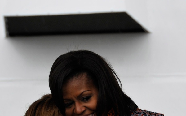 First Lady Michelle Obama congratulates Melinda Cook, the grandniece of US Coast Guard Capt. Dorothy Stratton during the commissioning ceremony of the Cutter Stratton