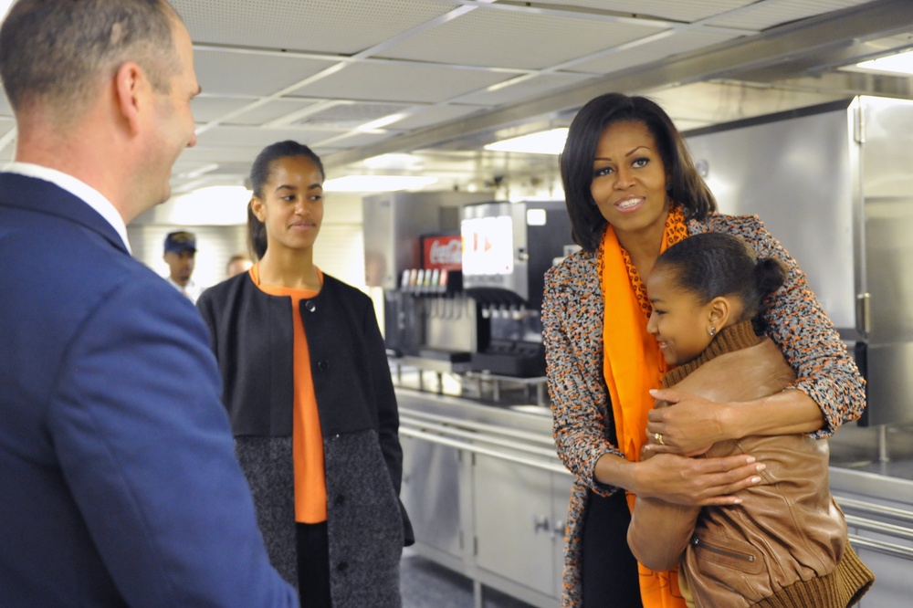 First Lady Michelle Obama and her daughters, Sasha and Malia, tour the Coast Guard Cutter Stratton