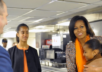 First Lady Michelle Obama and her daughters, Sasha and Malia, tour the Coast Guard Cutter Stratton