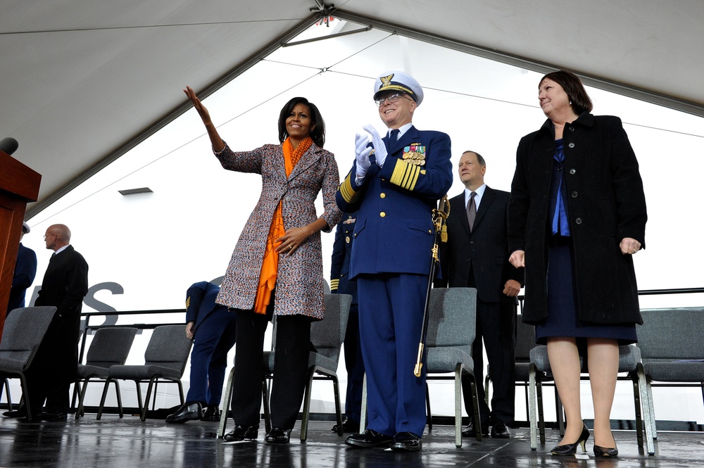 First Lady Michelle Obama and Coast Guard Commandant Adm. Bob Papp applaud during the Coast Guard Cutter Stratton's commissioning