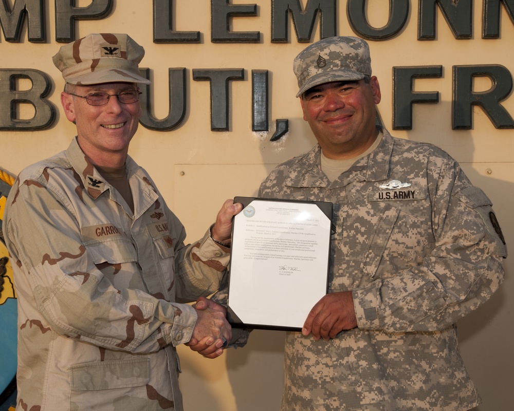 First soldier assigned to CJTF-HOA receives Navy EXW pin