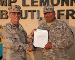 First soldier assigned to CJTF-HOA receives Navy EXW pin