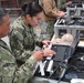 Seabees operate passport scanner during ECC drill