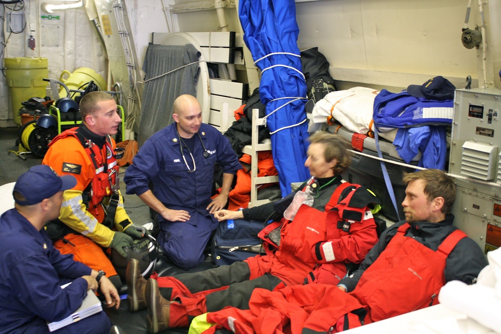 Cutter Bertholf's medical specialists attend to two injured sailors