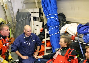 Cutter Bertholf's medical specialists attend to two injured sailors