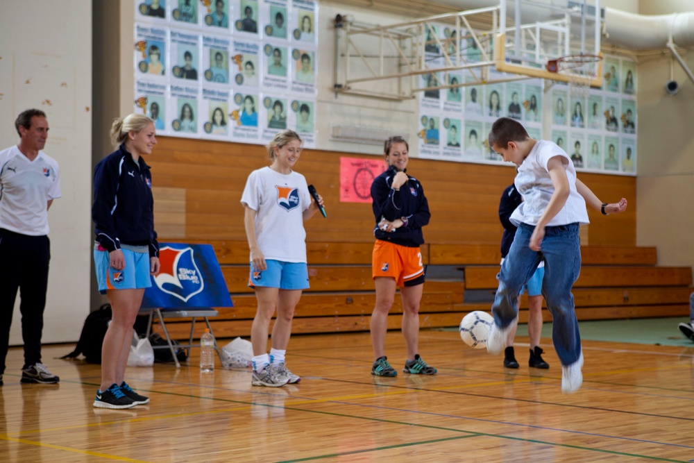 Professional soccer players speak to students about soccer, life