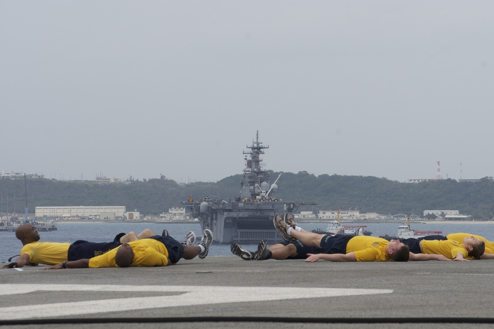 USS Bonhomme Richard sailors exercise on flight deck