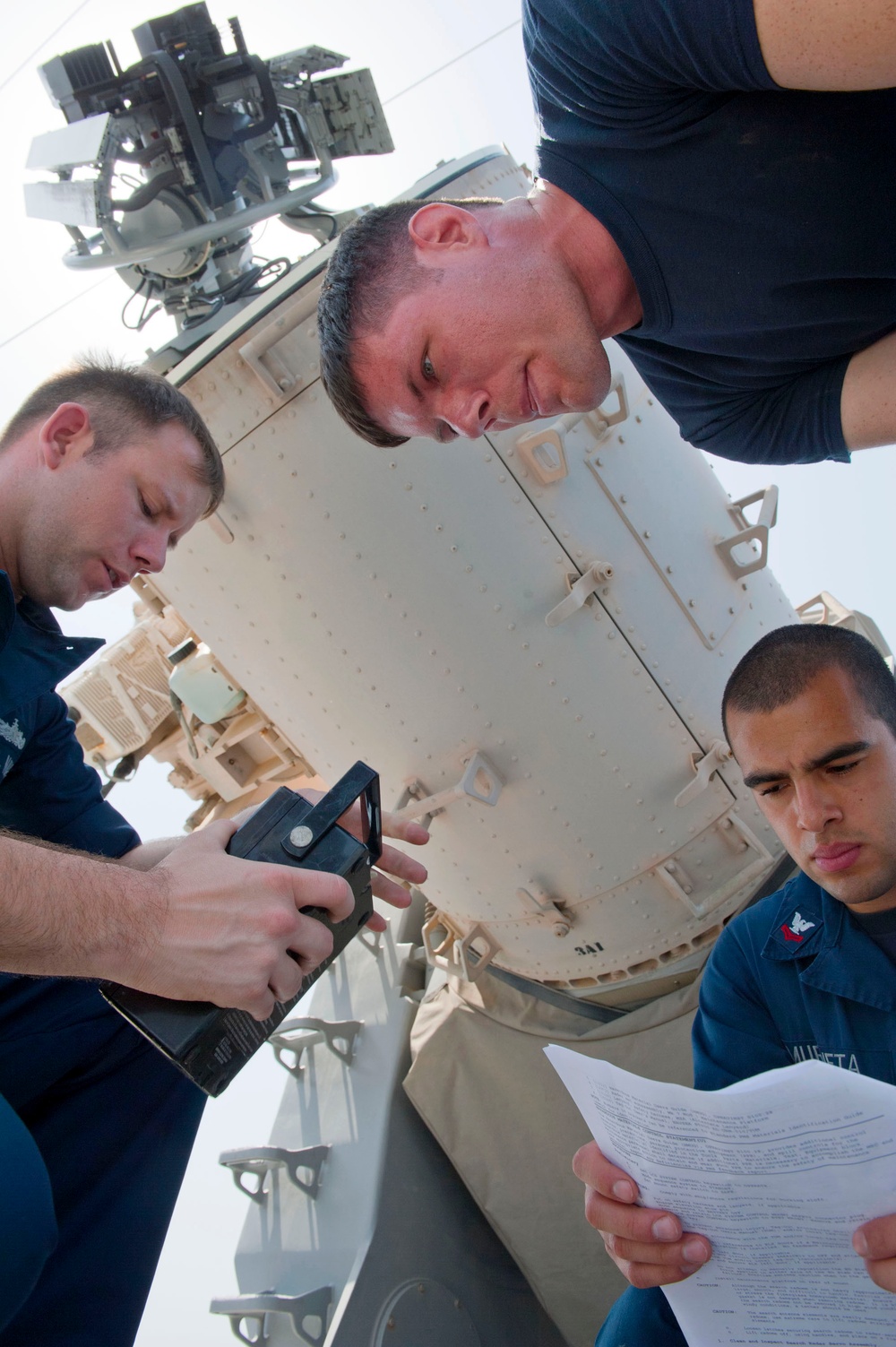 USS Cape St. George sailors perform maintenance