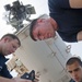 USS Cape St. George sailors perform maintenance