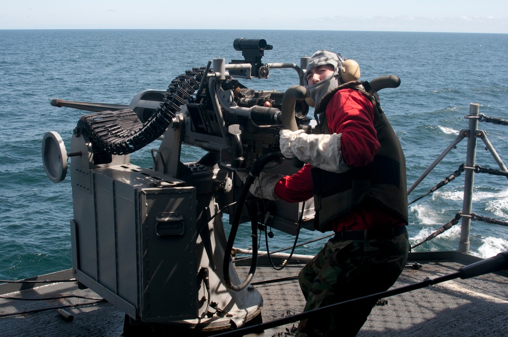 USS Kearsarge sailor preps machine gun