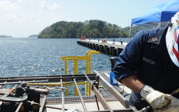 MDSU 2 sailors replace cemetery gate