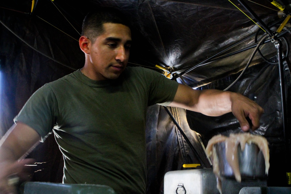 Two Marines feed a battalion, fuel the mission
