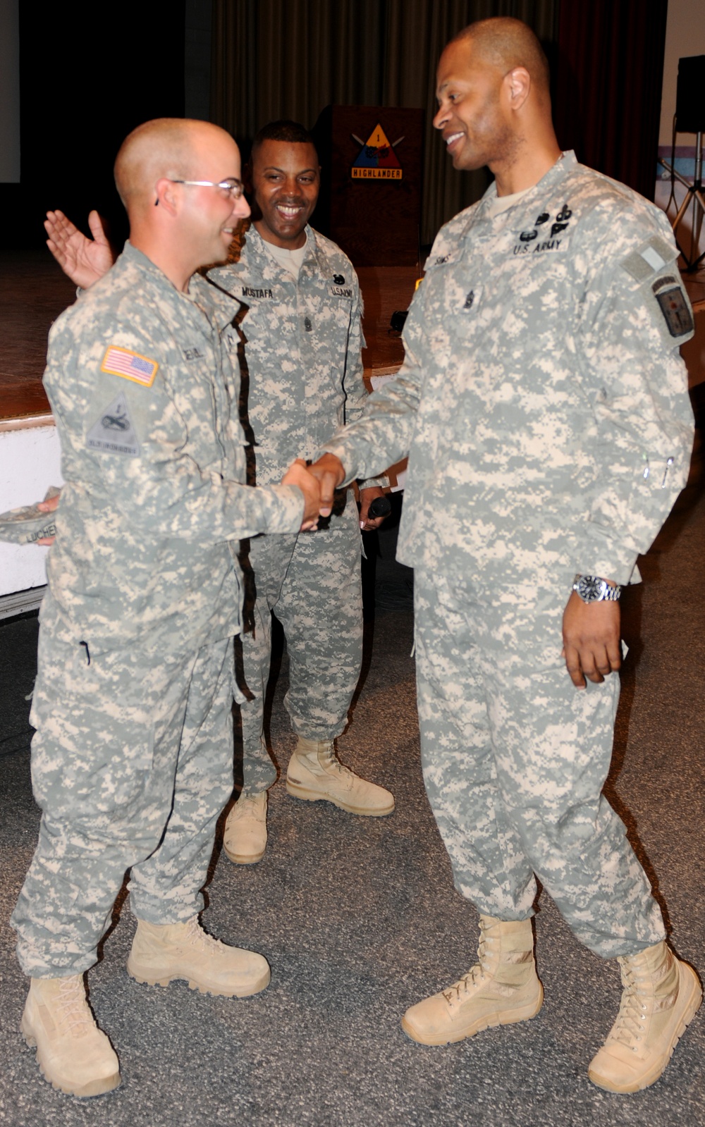 Command Sgt. Maj. Sims gives coin