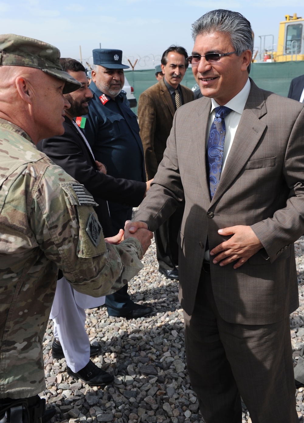 Lt. Col. Gordon &quot;Mark&quot; Bartley (left), Herat area office, USACE Afghanistan Engineer District-South, greets Herat provincial governor Dr. Daud Saba before a groundbreaking ceremony for two fire stations in Herat City