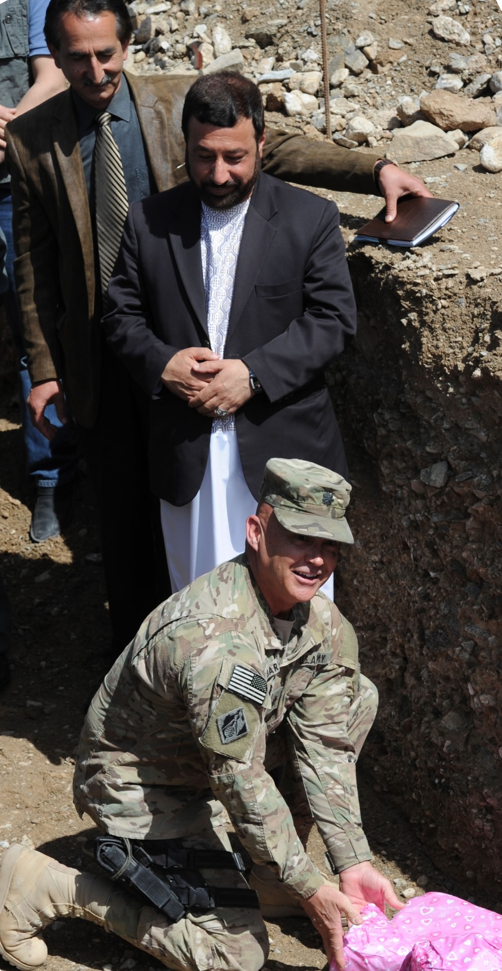 Lt. Col. Gordon &quot;Mark&quot; Bartley, USACE Afghanistan Engineer District-South, places a cornerstone during the groundbreaking for two fire stations in Herat City