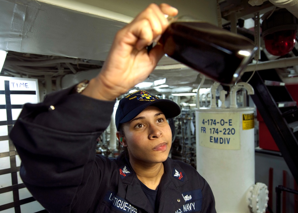USS James E. Williams sailor conducts inspection