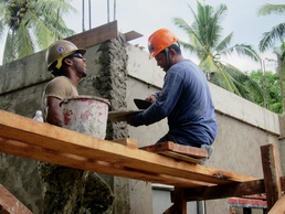 Smiling ear to ear, Philippine and U.S. military members bond during civic outreach project
