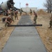 Seabees build sidewalk in Spain