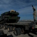 Marines and soldiers load heavy equipment during African Lion 2012