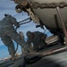 Marines and soldiers load heavy equipment during African Lion 2012