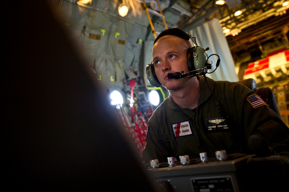USCG HC-130 Hercules performs search and rescue training mission off the coast of Oahu