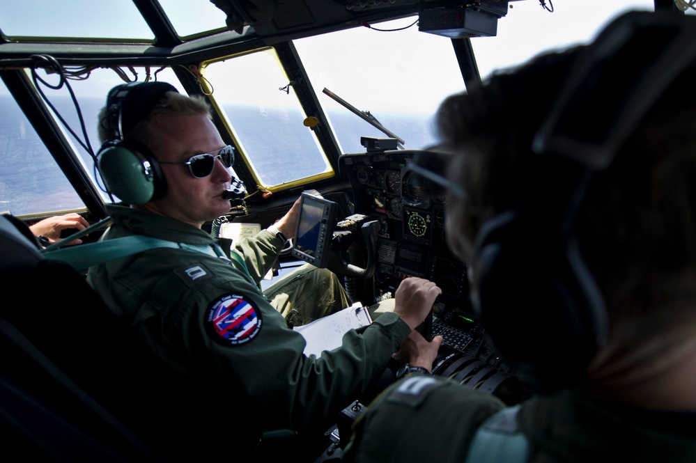 USCG HC-130 Hercules performs search and rescue training mission off the coast of Oahu